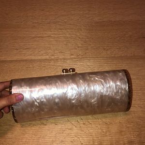 Gold round Edie Parker clutch